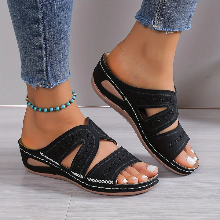 Stylish Women's Sandals Featuring a Sophisticated Wedge Heel and Distinctive Cutout Design