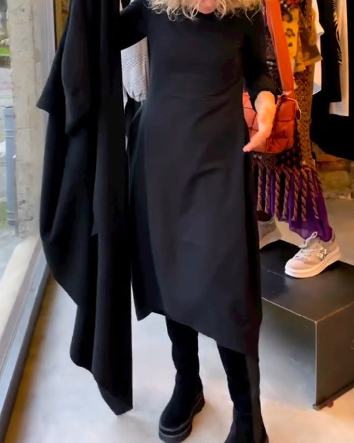 Elevate Your Style with the Black Midi Dress Featuring Convenient Pockets