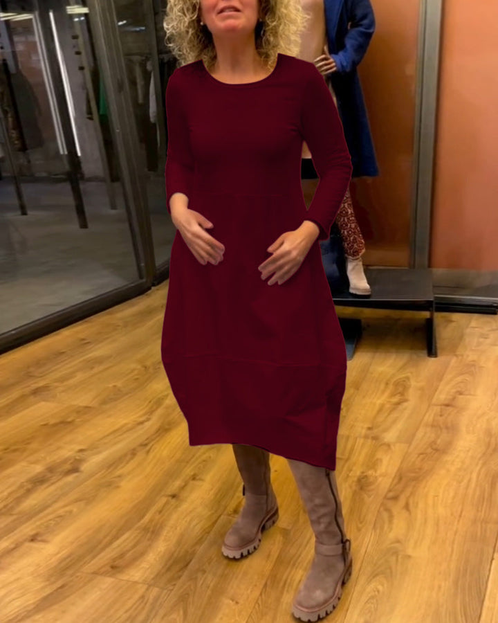 Elevate Your Style with the Black Midi Dress Featuring Convenient Pockets