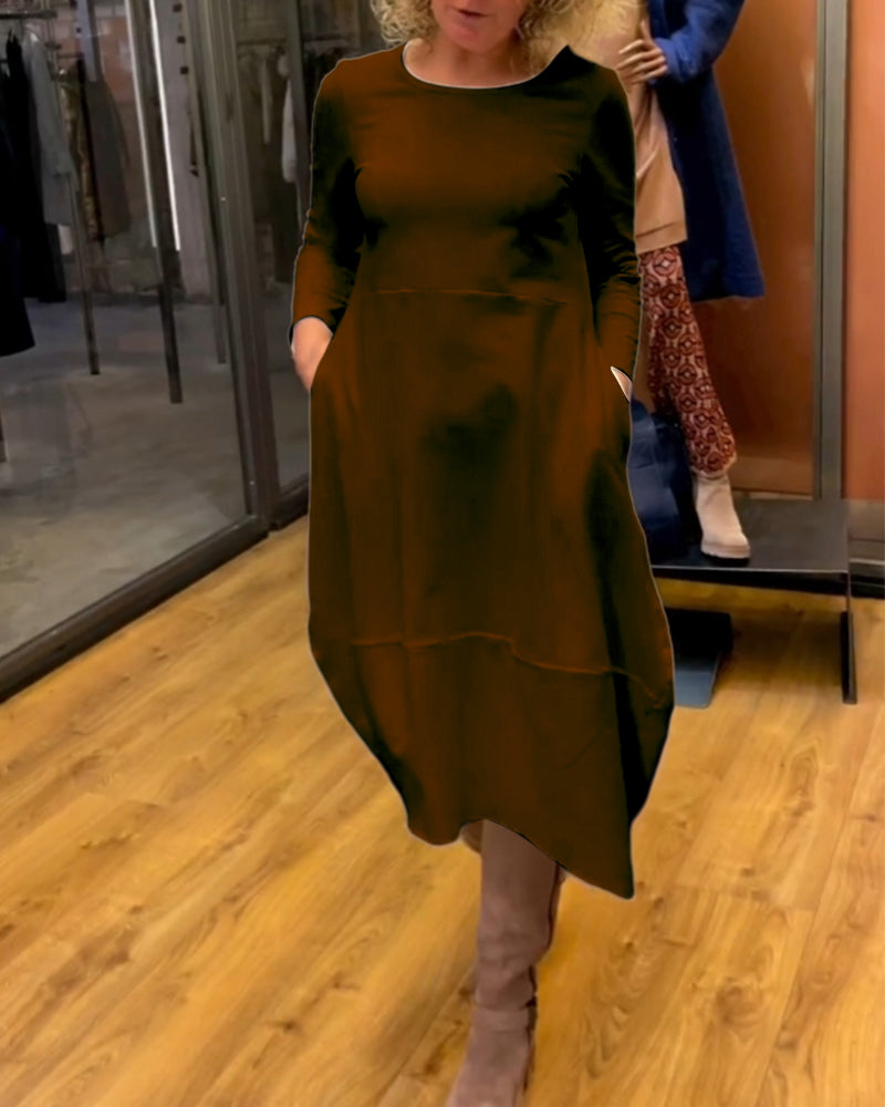 Elevate Your Style with the Black Midi Dress Featuring Convenient Pockets