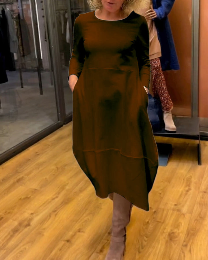 Elevate Your Style with the Black Midi Dress Featuring Convenient Pockets