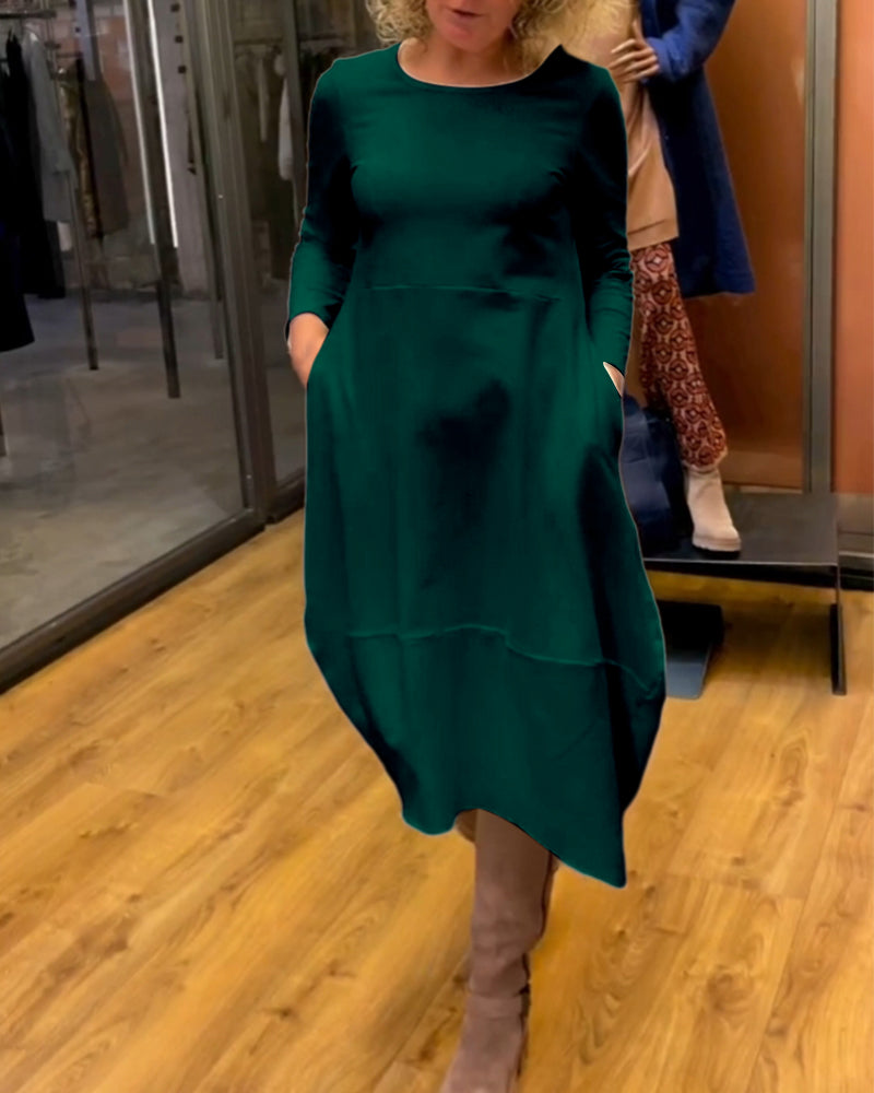 Elevate Your Style with the Black Midi Dress Featuring Convenient Pockets