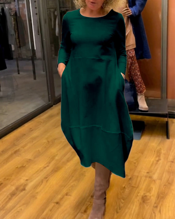 Elevate Your Style with the Black Midi Dress Featuring Convenient Pockets