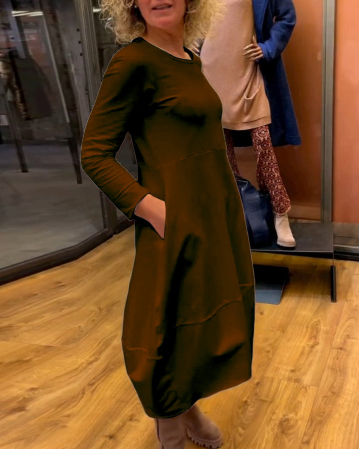 Elevate Your Style with the Black Midi Dress Featuring Convenient Pockets