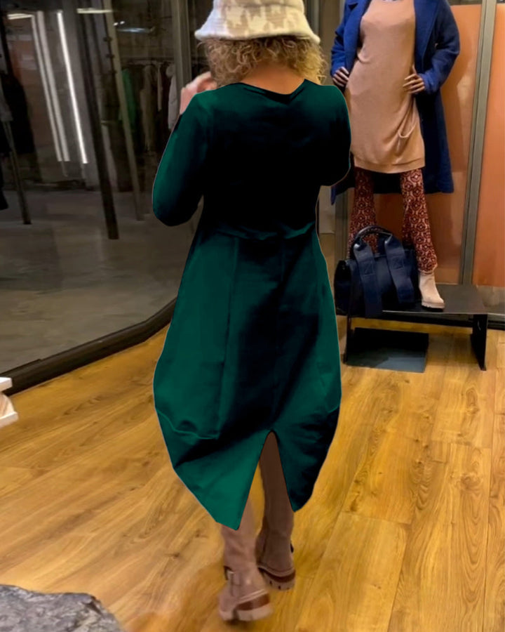 Elevate Your Style with the Black Midi Dress Featuring Convenient Pockets