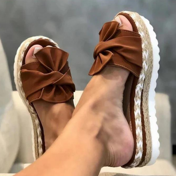 Elegantly Designed Women's Sandals Featuring a Trendy Bow Accent