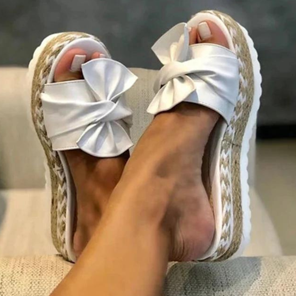 Elegantly Designed Women's Sandals Featuring a Trendy Bow Accent
