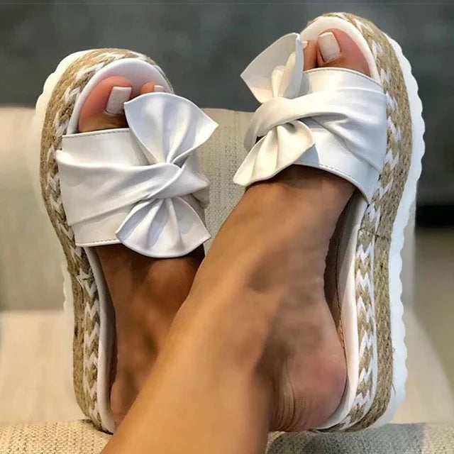 Trendy sandals adorned with delightful bows
