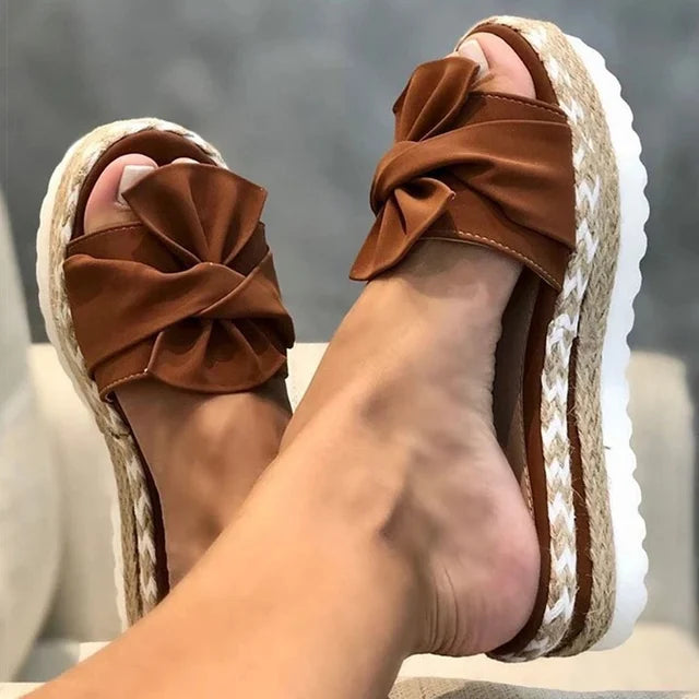 Trendy sandals adorned with delightful bows