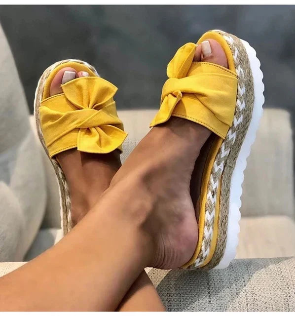 Trendy sandals adorned with delightful bows