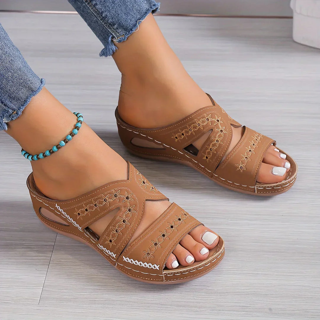 Stylish Women's Sandals Featuring a Sophisticated Wedge Heel and Distinctive Cutout Design