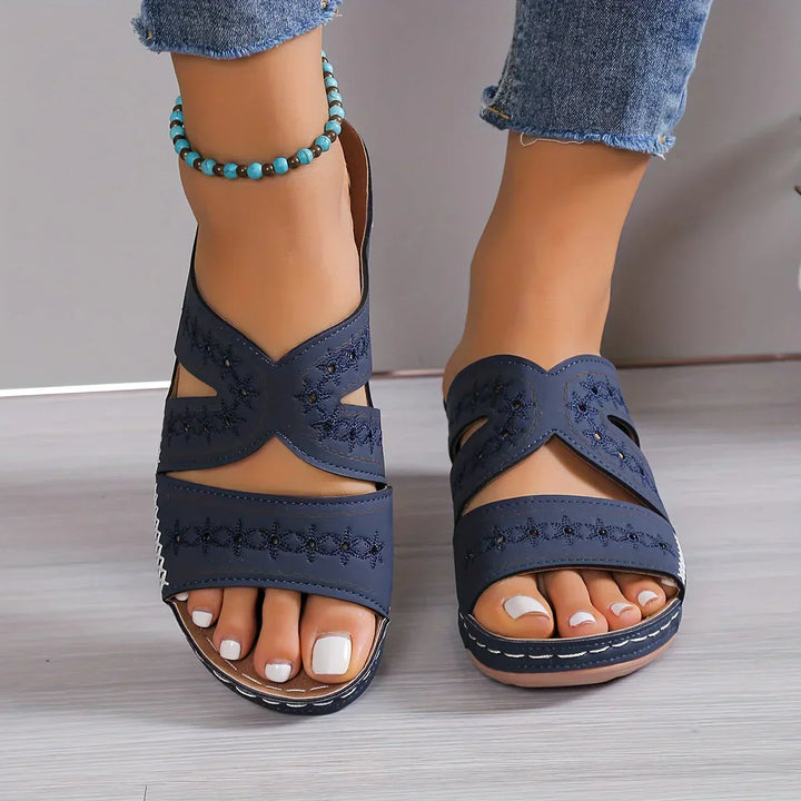 Stylish Women's Sandals Featuring a Sophisticated Wedge Heel and Distinctive Cutout Design