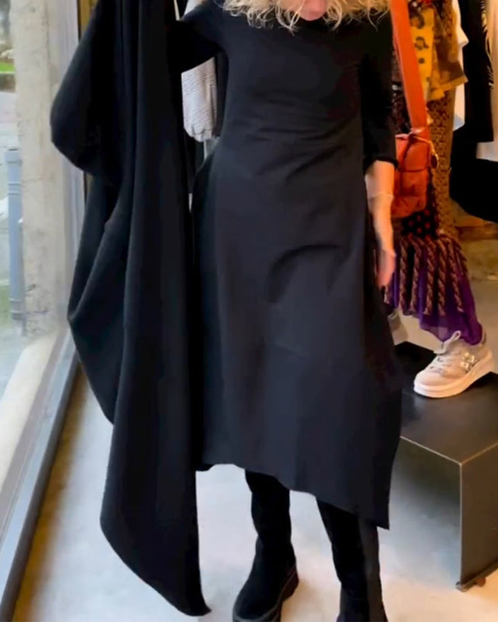 Elevate Your Style with the Black Midi Dress Featuring Convenient Pockets