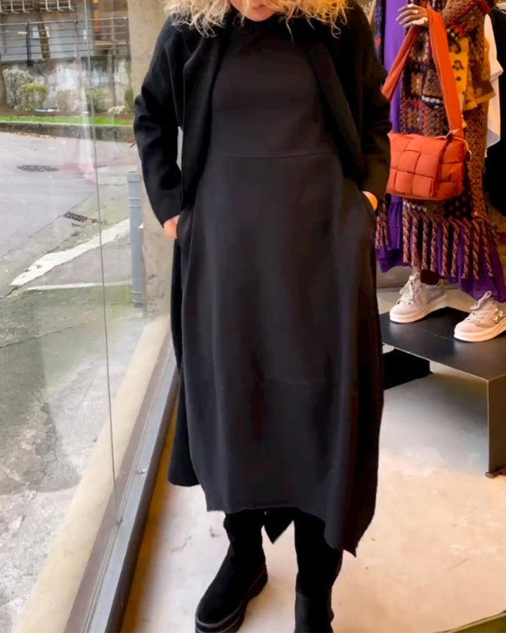 Elevate Your Style with the Black Midi Dress Featuring Convenient Pockets
