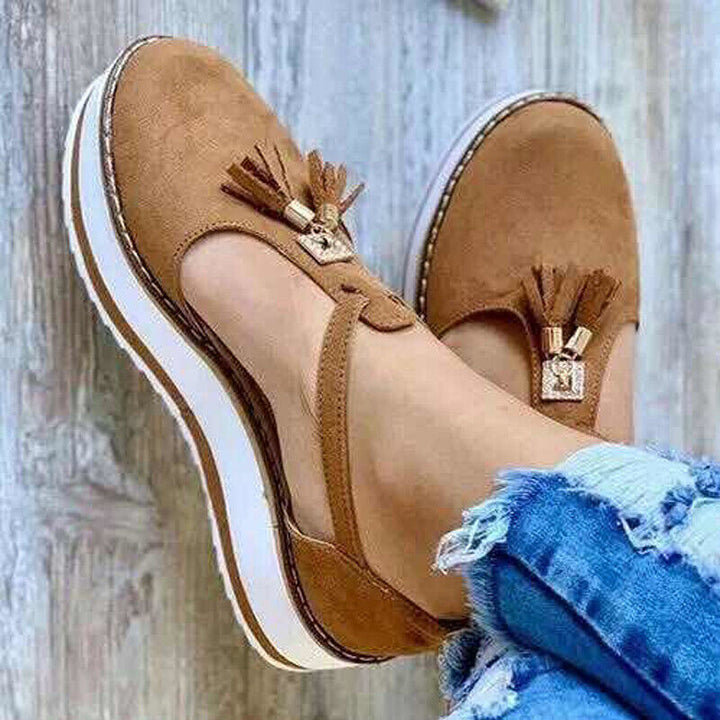 Stylish loafer sandals adorned with elegant tassels