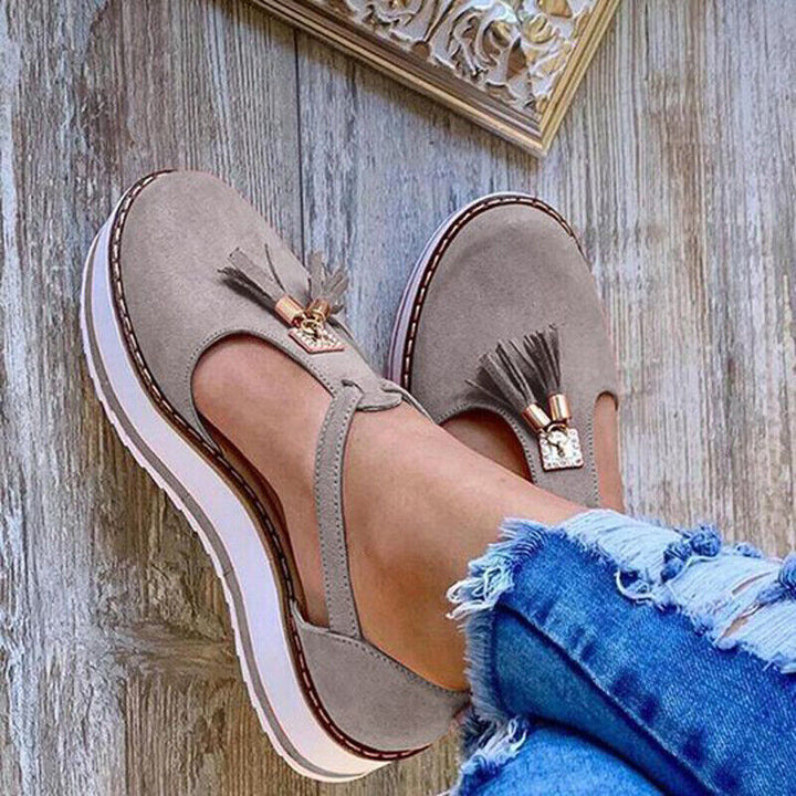 Stylish loafer sandals adorned with elegant tassels