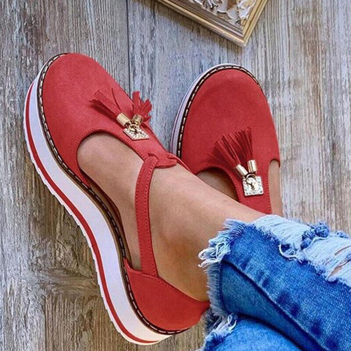 Stylish loafer sandals adorned with elegant tassels
